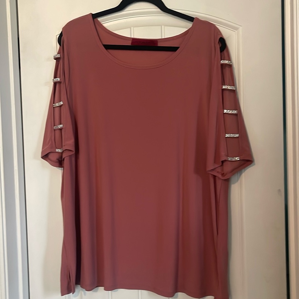 Brand new!!Rose colored shirt with open shoulder with jewels.